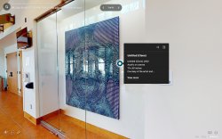 Screenshot of a virtual walkthrough of the exhibition in the Kasser Theater lobby. Highlighted is a blue and white painting.
